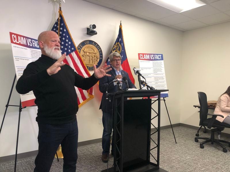 Georgia voting system manager Gabriel Sterling (right) and sign language interpreter David Cowan at a press conference Tuesday.