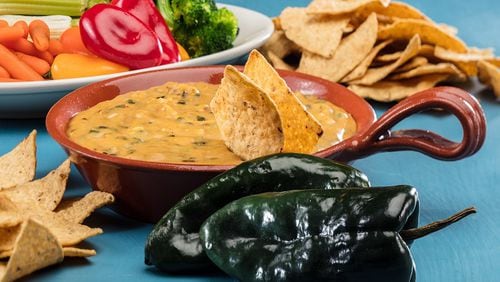 Vegan nacho cheese from America's Test Kitchen's latest book "Vegan for Everyone," has a potato and carrot base, which is flavored with poblanos, chipotle, cumin, mustard and nutritional yeast. Food stying by Lisa Schumacher.(Zbigniew Bzdak/Chicago Tribune/TNS)