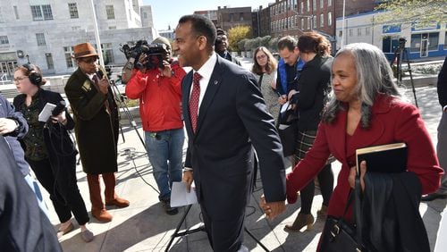 Former Atlanta Fire Chief Kelvin Cochran and his wife Carolynn Cochran leave Richard B. Russell Federal Building after his hearing on Friday, November 17, 2017. Former Atlanta Fire Chief Kelvin Cochran filed a federal civil rights lawsuit against Mayor Kasim Reed and the city, saying he was terminated in 2015 because of his religion. HYOSUB SHIN / HSHIN@AJC.COM