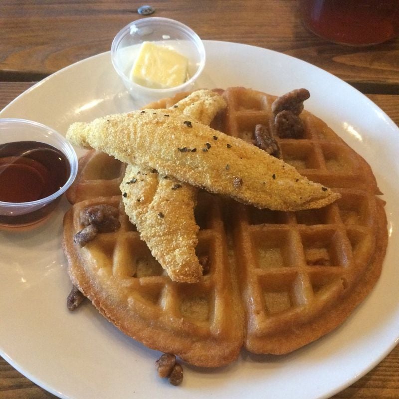 The catfish and waffles is a delicious sweet-savory dish at Catfish Hox in Marietta. With butter, maple syrup and candied pecans, it’s a nice starter for the table. CONTRIBUTED BY WENDELL BROCK