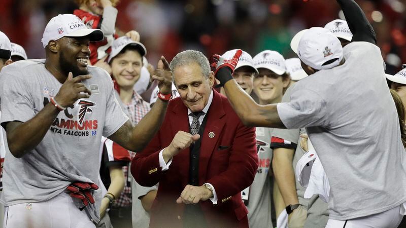  Atlanta Falcons owner Arthur Blank dances with players after the NFC championship game against the Green Bay Packers, Sunday, Jan. 22, 2017, in Atlanta. The Falcons won 44-21 to advance to Super Bowl LI. (David Goldman/AP)