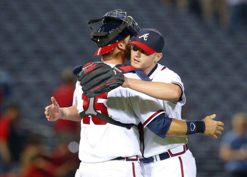 Shelby Miller gets a hug from catcher A.J. Pierzynski after Miller's three-hit shutout against the Phillies last week. (AP photo)