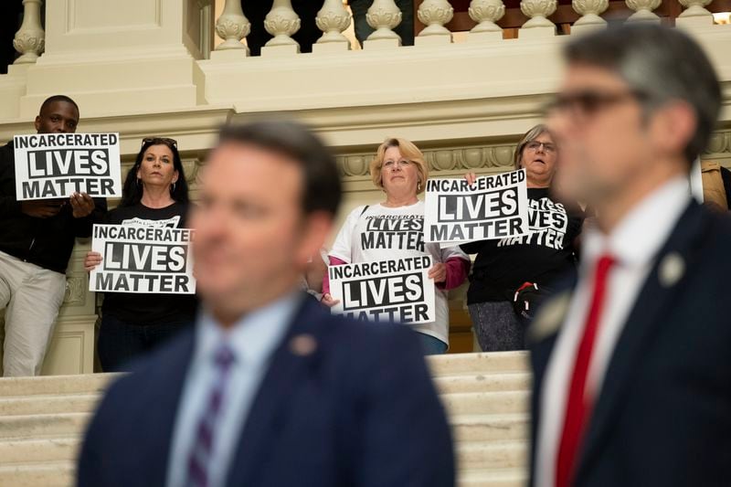 Protesters for better treatment of inmates urge lawmakers at the state Capitol to act. The midyear budget and Gov. Brian Kemp’s proposed fiscal 2025 budget call for tens of millions of new dollars for the Department of Corrections.  (Ben Gray / Ben@BenGray.com)

