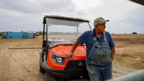 Ronnie Bobo speaks to a reporter at the edge of his property near the town of Mitchell on Wednesday, October 12, 2022. Bobo’s field contains soil amendment. (Arvin Temkar / arvin.temkar@ajc.com)