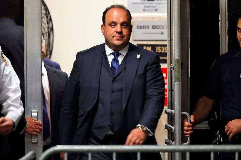 Boris Epshteyn, an aide to former President Donald Trump, returns to the courtroom after a lunch recess during Trump's trial at Manhattan criminal court before his trial in New York, Friday, April 26, 2024. The Arizona attorney general’s office released a copy of the indictment Friday, April 26, 2024, that revealed conspiracy, fraud and forgery charges were filed against former Trump aide Mike Roman and attorneys John Eastman, Christina Bobb, Boris Epshteyn and Jenna Ellis. The lawyers were accused of organizing an attempt to use fake documents to persuade Congress not to certify Joe Biden’s victory. (Michael M. Santiago/Pool Photo via AP)