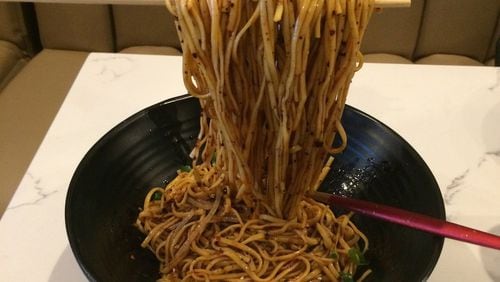 The Chengdu cold noodles are probably the most Instagram-worthy dish at Gu’s Kitchen, thanks to the floating chopsticks presentation. CONTRIBUTED BY WENDELL BROCK
