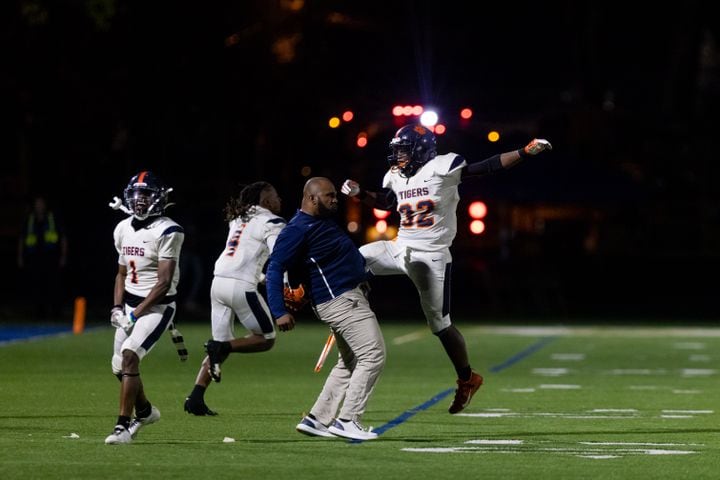 Mundy's Mill’s Chris Joseph (32) celebrates with his coach during a GHSA High School football game between St. Pius and Mundy’s Mill at St. Pius Catholic School in Atlanta, GA, on Friday, November 11, 2022.(Photo/Jenn Finch)