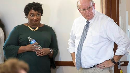 DuBose Porter, right, chairman of the Georgia Democratic party, with gubernatorial candidate Stacey Abrams at an October campaign event in Crawfordville, Ga. ALYSSA POINTER/ALYSSA.POINTER@AJC.COM