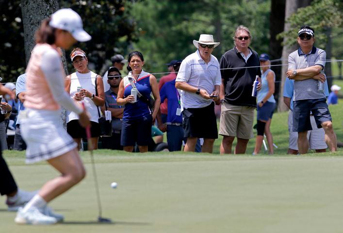 Fans react as Sei Young Kim misses a shot at the 14th hole during the second round of the KPMG Women’s PGA Championship at Atlanta Athletic Club in Johns Creek on Friday, June 25, 2021. (Christine Tannous / christine.tannous@ajc.com)