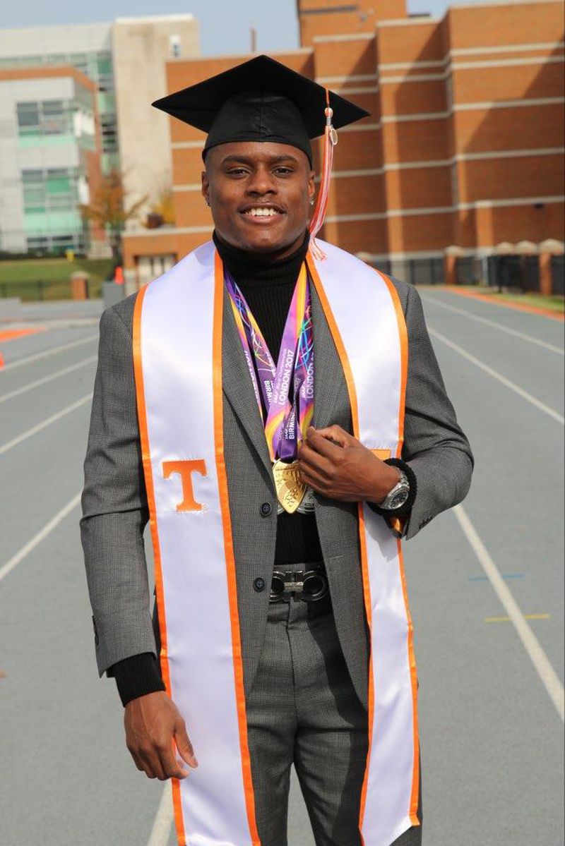 Christian Coleman accessorizes the graduate look with a few of his track medals. 