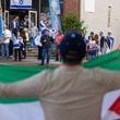 Pro-Palestine protestor Taqi Hasan of Snellville (foreground) demonstrates as supporters of Israel hold a Passover gathering at Ali’s Cookies in Decatur on Thursday, April 25, 2024. (Arvin Temkar / AJC)