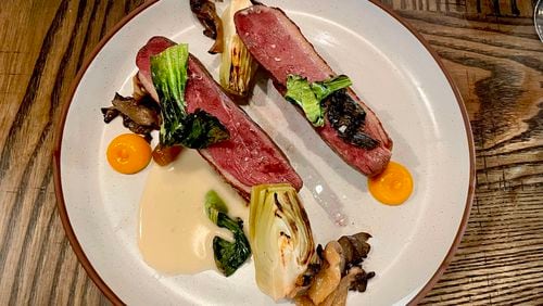 The duck breast at Foundation Social Eatery is served with marinated oyster mushrooms, brined bok choy and kumquat gel. Angela Hansberger for The Atlanta Journal-Constitution