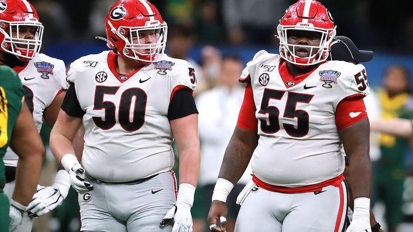 Georgia offensive lineman Warren Ericson (50) and Trey Hill (55) work against Baylor in the Sugar Bowl on Wednesday, January 1, 2020, in New Orleans.  Curtis Compton ccompton@ajc.com