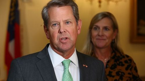 081022 Atlanta: Governor Brian P. Kemp, with First Lady Marty Kemp, takes questions from the media following a special economic development announcement on Wednesday, August 10, 2022, in Atlanta.   “Curtis Compton / Curtis Compton@ajc.com