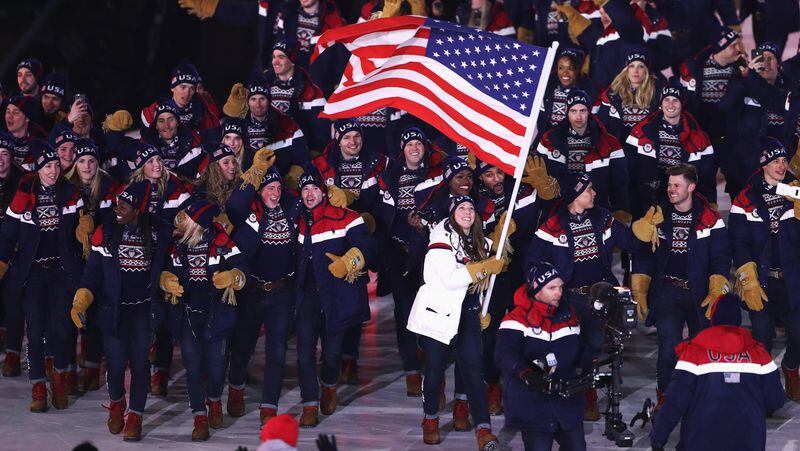 Flag bearer Erin Hamlin of the United States leads the team during the Opening Ceremony of the PyeongChang 2018 Winter Olympic Games.