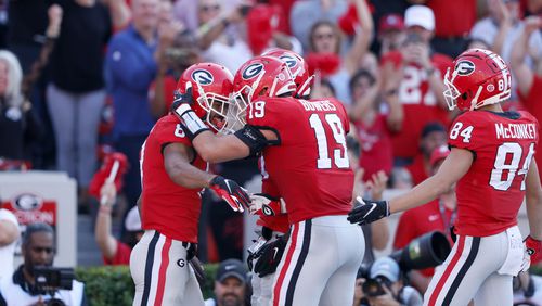 Georgia Bulldogs wide receiver Dominick Blaylock (8) celebrates his 10-yard touchdown catch with tight end Brock Bowers (19) during the second quarter against the Vanderbilt Commodores at Sanford Stadium, Saturday, Oct. 15, 2022, in Athens, Ga. (Jason Getz / Jason.Getz@ajc.com)
