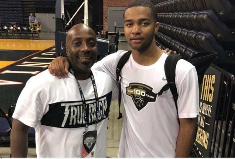 Kyle Sturdivant (right) poses with his father Gary during a basketball camp at the University of Virginia.