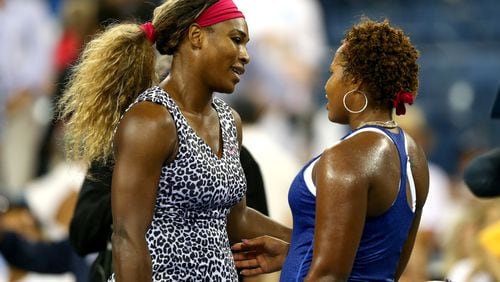 Taylor Townsend (right) congratulates Serena Williams (left)  during their women's singles first round match on Day Two of the 2014 US Open. Townsend will compete in the 2018 French Open.