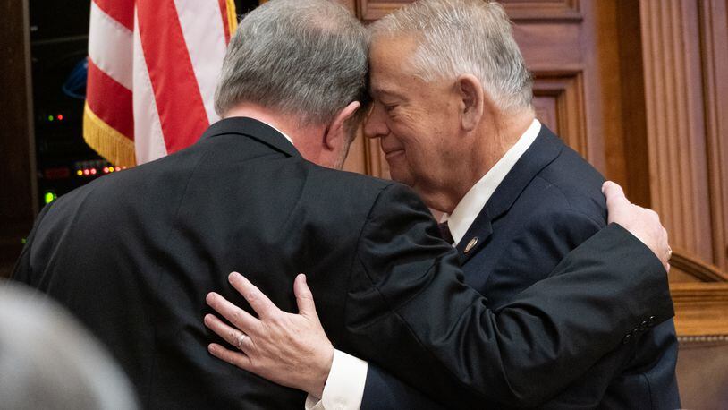House Speaker David Ralston, right, hugs Rep. Terry England, R-Auburn, in February after England announced that he would not seek reelection. Ralston died last week. Ben Gray for the Atlanta Journal-Constitution