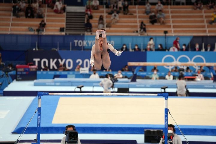 Sunisa Lee of the United States performs on the uneven bars during the women's all-around gymnastics competition at the postponed 2020 Tokyo Olympics in Tokyo on Thursday, July 29, 2021. (Chang W. Lee/The New York Times)