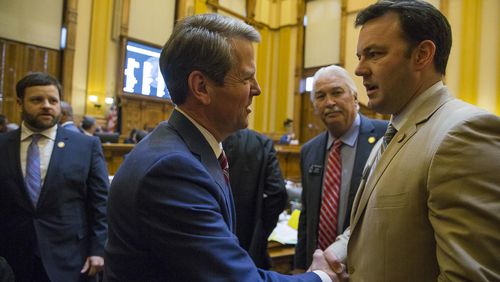 Gov. Brian Kemp shakes the hand of state Sen. Burt Jones, author of a measure that would allow the state to take over Atlanta’s airport, on the final day of the 2019 session of the Legislature. ALYSSA POINTER/ALYSSA.POINTER@AJC.COM