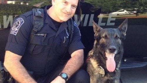 Lawrenceville police K9 Eiko, seen here with handler Officer Shawn Humphreys, passed away Thursday after being diagnosed with cancer. (Courtesy of Lawrenceville Police Department)