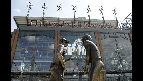 A nine-foot bronze statue depicting Philadelphia Eagles quarterback Nick Foles, right, and head coach Doug Pederson discussing the "Philly Special" trick play is seen at Lincoln Financial Field, Wednesday, Sept. 5, 2018, in Philadelphia. The statue, unveiled by Bud Light, highlights the famous play from the Philadelphia Eagles' 41-33 win over the New England Patriots in Super Bowl 52. (AP Photo/Matt Slocum)
