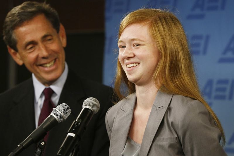 Abigail Fisher, who sued the University of Texas when she was not offered a spot at the university’s flagship Austin campus in 2008, with Edward Blum of the Project on Fair Representation, speaks at a news conference at the American Enterprise Institute in Washington on Monday. The U.S. Supreme Court ruling on affirmative action in higher education will have “no impact” on the University of Texas’ admissions policy, school president Bill Powers said Monday, noting UT will continue to use race as a factor in some cases.