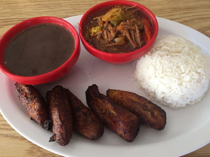 Cuba Mia offers island classics like ropa vieja (shredded beef stew), shown here with black beans, rice and buttery fried plantains. CONTRIBUTED BY WENDELL BROCK