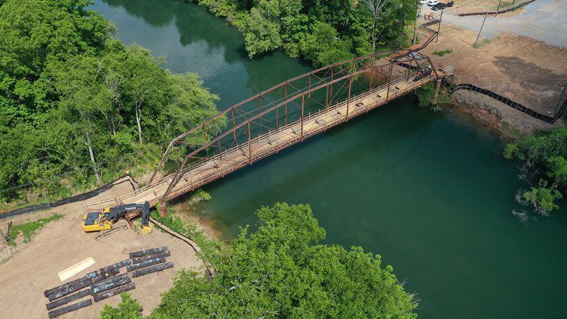 The Rogers Bridge replacement construction project continues over the Chattahoochee River, connecting Johns Creek and Duluth. The historic bridge that dates back to the early 1900s will soon be demolished but the salvaged steel will be divided between the two cities. (Courtesy City of Johns Creek)