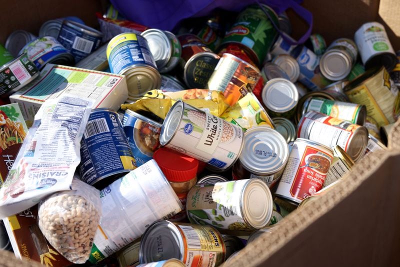 Food donations are collected during the Food-A-Thon event at the Atlanta Community Food Bank, Friday, November 4, 2022, in East Point, Ga. (Jason Getz / Jason.Getz@ajc.com)