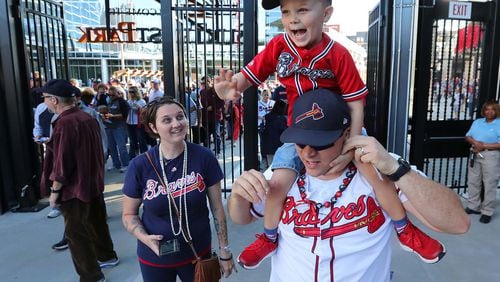 March 31, 2017, Atlanta: Excited Braves fans David Swinehamer, his son Austin, 4, and wife Amber enter the gates for the first time for the MLB exhibition game against the N.Y. Yankees for the soft opening of SunTrust Park on Friday, March 31, 2017, in Atlanta.   Curtis Compton/ccompton@ajc.com