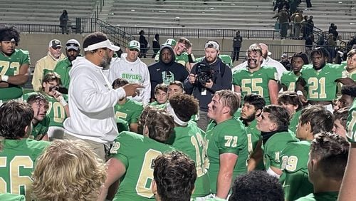 Buford head coach Bryant Appling talks with his team following its 21-6 victory over Carrollton in the Class 6A semifinals on Dec. 3, 2021.