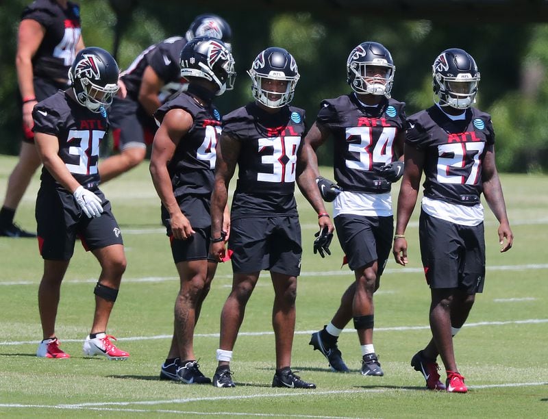 Falcons rookie cornerbacks and safeties Avery Williams (from left), JR Pace, Marcus Murphy, Darren Hall, and Richie Grant line up to run a defensive drill during rookie minicamp on Friday, May 14, 2021, in Flowery Branch. (Curtis Compton / Curtis.Compton@ajc.com)