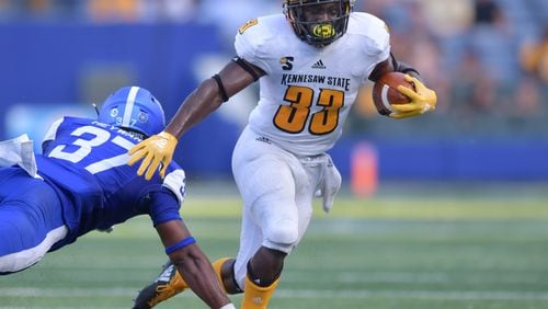 August 30, 2018 Atlanta - Kennesaw State running back Darnell Holland (33) eludes a tackle by Georgia State linebacker Victor Heyward (37) in the first half during the 2018 season opening game against the Kennesaw State at Georgia State Stadium on Thursday, August 30, 2018. HYOSUB SHIN / HSHIN@AJC.COM