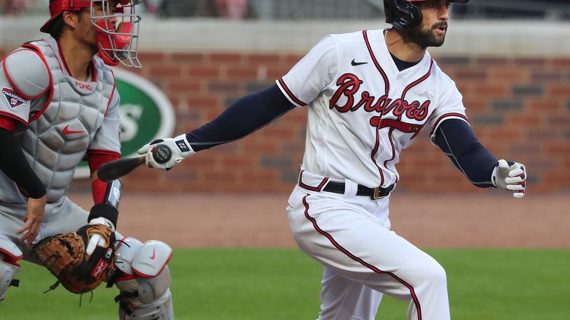 Braves outfielder Nick Markakis rips a double to score Marcell Ozuna with Washington Nationals catcher Kurt Suzuki looking on Monday, August 17, 2020 in Atlanta.    Curtis Compton ccompton@ajc.com