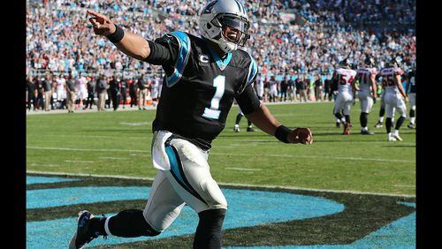 CHARLOTTE: Panthers quarterback Cam Newton celebrates a score for a 21-0 lead over the Falcons during the first quarter in a football game on Sunday, Dec. 13, 2015, in Charlotte. Curtis Compton / ccompton@ajc.com
