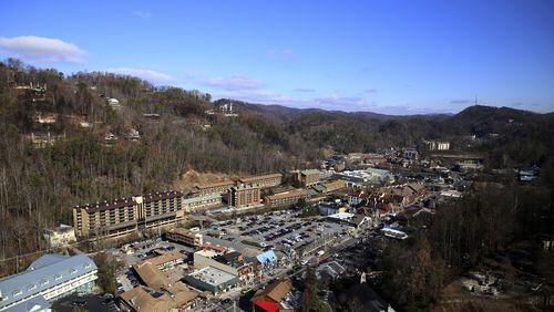 The view from the Space Needle shows Gatlinburg, Tenn., as the resort city reopens to the public on Friday, Dec. 9, 2016, nearly two weeks after a devastating wildfire. Most of the main tourist area in Gatlinburg was spared by the fires that were whipped into the city by hurricane-force winds the night of Nov. 28, and officials are keen for people to return to the city with a population of less than 4,000 that draws more than 11 million visitors a year. (Caitie McMekin/Knoxville News Sentinel via AP)