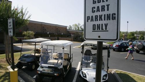 Golf carts would be regulated under an ordinance that recently got a first reading in Woodstock. AJC FILE