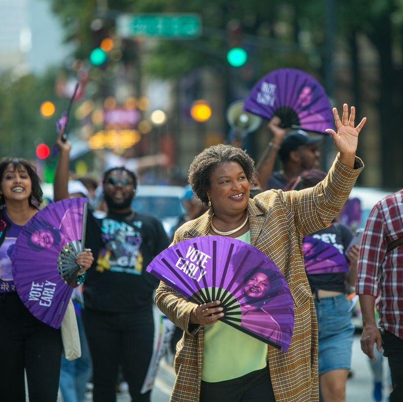 Stacey Abrams participates in the Pride Parade on Peachtree Street on Sunday, Oct.9, 2022.  (Jenni Girtman for The Atlanta Journal-Constitution)