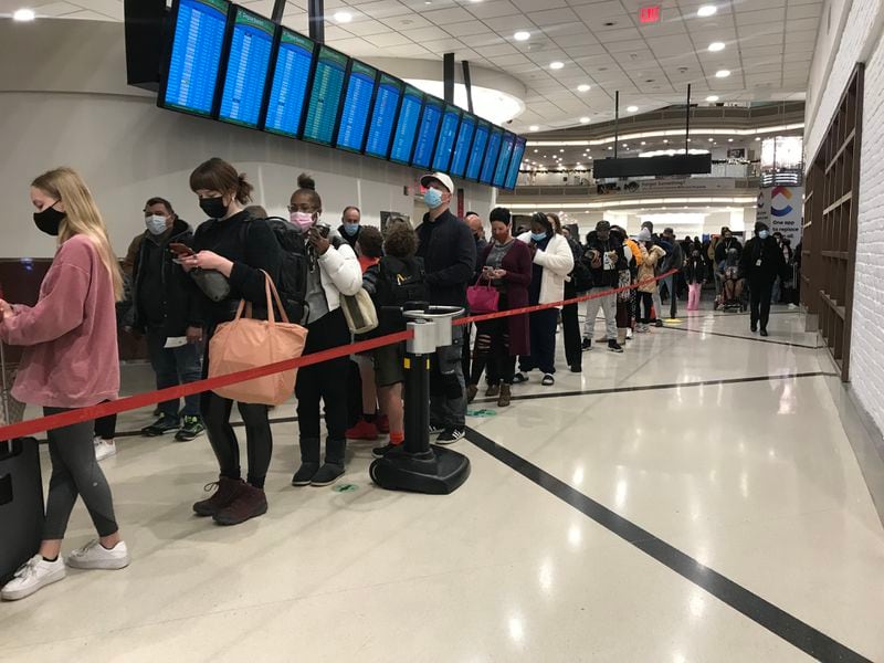 Lines for the main security checkpoint in the domestic terminal at Hartsfield-Jackson International Airport on Nov. 24, 2021 stretched out of the queueing area and into the atrium starting in the early morning hours.