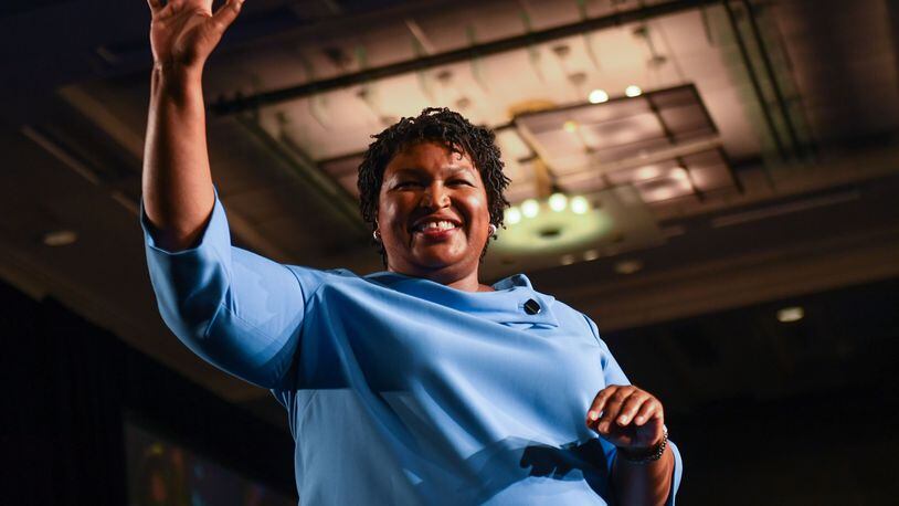 Democratic Georgia gubernatorial candidate Stacey Abrams addresses the crowd in the early morning hours on Nov. 7, 2018, at the Hyatt Regency Hotel in downtown Atlanta. She told supporters votes still needed to be counted and of the chance of a runoff election. (ALYSSA POINTER/ALYSSA.POINTER@AJC.COM)