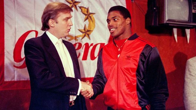 <p>In this March 1984 file photo, Donald Trump shakes hands with Herschel Walker in New York after agreement on a 4-year contract with the New Jersey Generals USFL football team. (AP Photo/Dave Pickoff, File)</p>