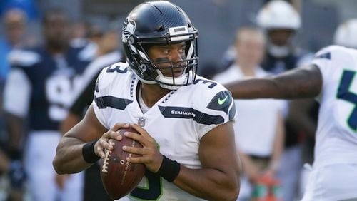 Seattle Seahawks quarterback Russell Wilson (3) throws a pass during the first half of an NFL football game against the Los Angeles Chargers Sunday, Aug. 13, 2017, in Carson, Calif. (AP Photo/Jae C. Hong)