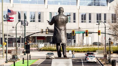 City of Atlanta unveils the bronze statue "Hope Moving Forward" honoring the life and legacy of Dr. Martin Luther King Jr. on Friday, January 15, 2021 near the intersection of Northside Drive and MLK Jr Drive.  This is the first of seven art installations commissioned by the city to honor MLK.  (Jenni Girtman for The Atlanta Journal Constitution)