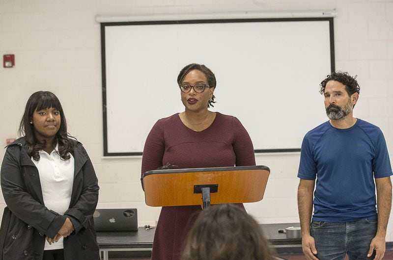 Allegra Lawrence-Hardy (center), legal counsel for Fair Fight Action, stands with Kia Carter (left) and Angel Poventud (right) during a Fair Fight Action press conference at the Pittman Park Recreation Center in Atlanta’s Pittsburgh community, Dec. 6, 2018. ALYSSA POINTER / ALYSSA.POINTER@AJC.COM