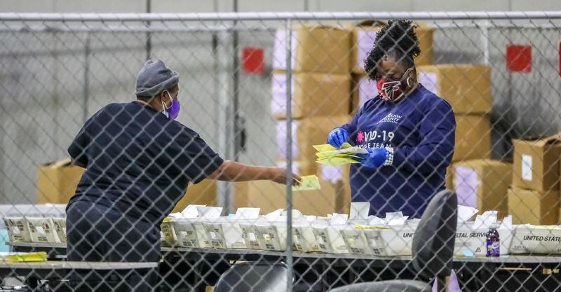 Fulton County election workers resumed counting ballots at 9:30 a.m. on Wednesday, Jan. 6, 2021. (John Spink / John.Spink@ajc.com)

