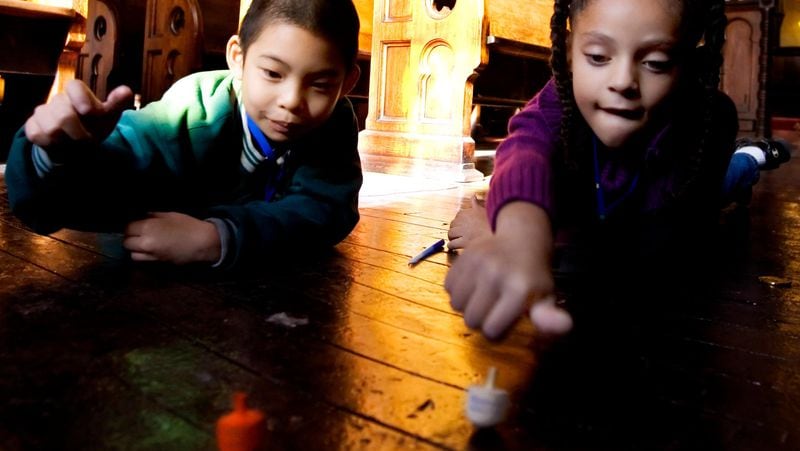 Children spin a dreidel for fun during Hanukkah, but the toy has a long history.