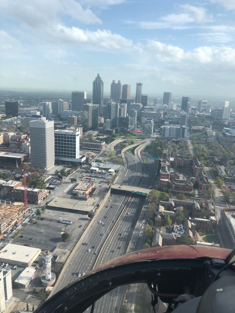 A nearly-empty Downtown Connector (I-75/85) in Midtown on Tuesday, March 24th, 2020 at 5:41 p.m. Credit: Doug Turnbull, WSB Skycopter