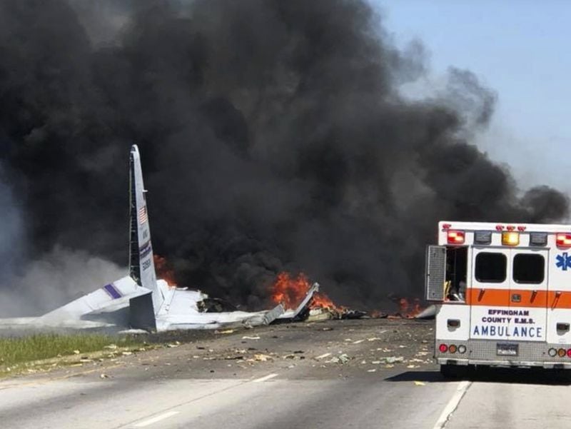 Flames and smoke rise from a WC-130 after it crashed near Savannah. (James Lavine via AP)